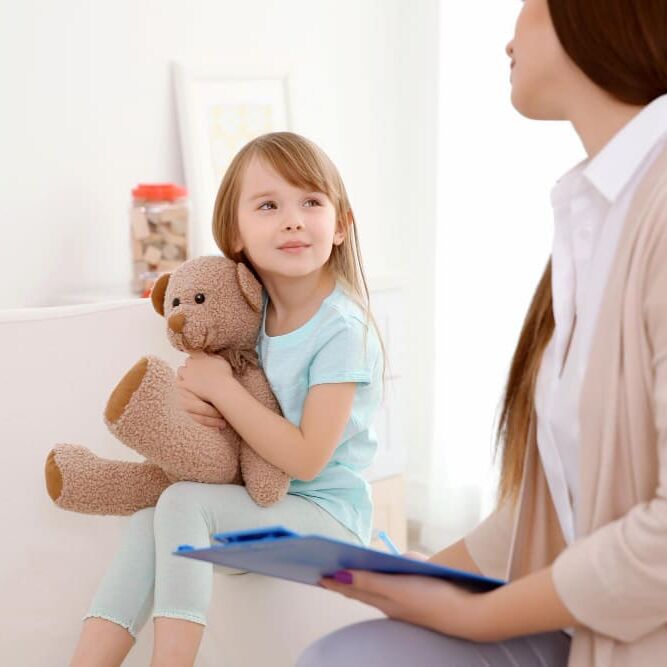 young-child-psychologist-working-with-little-girl (1)